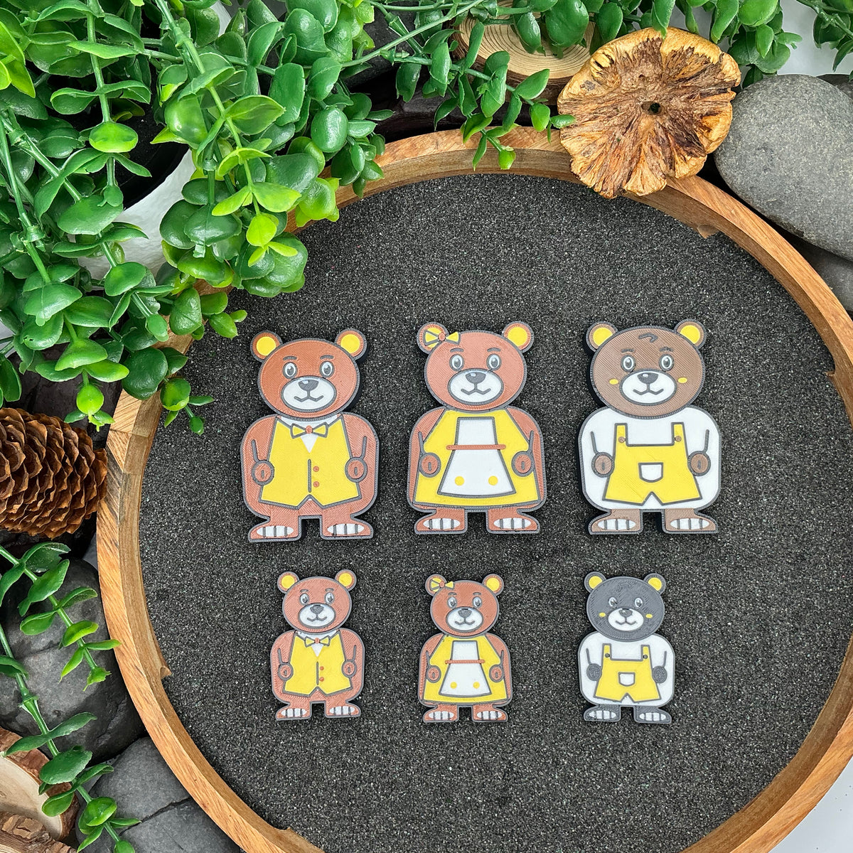 Large and Small Daddy Bear, Mummy Bear and Baby Bear figures compared from above