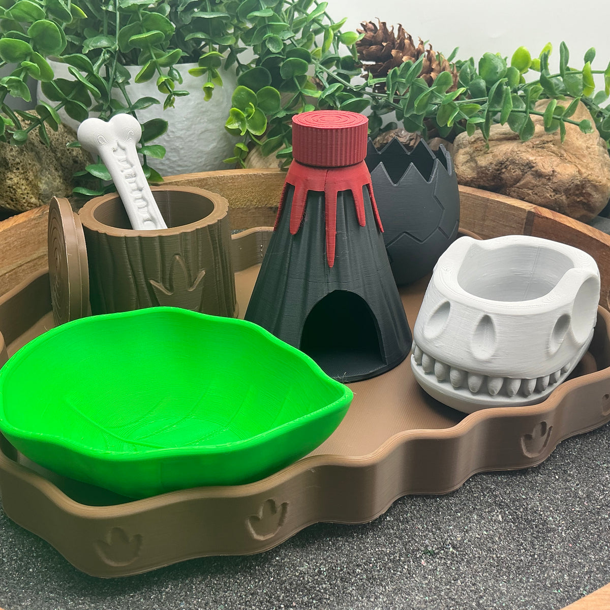 Dinosaur sensory kit close-up with leaf bowl, volcano and skull bowl