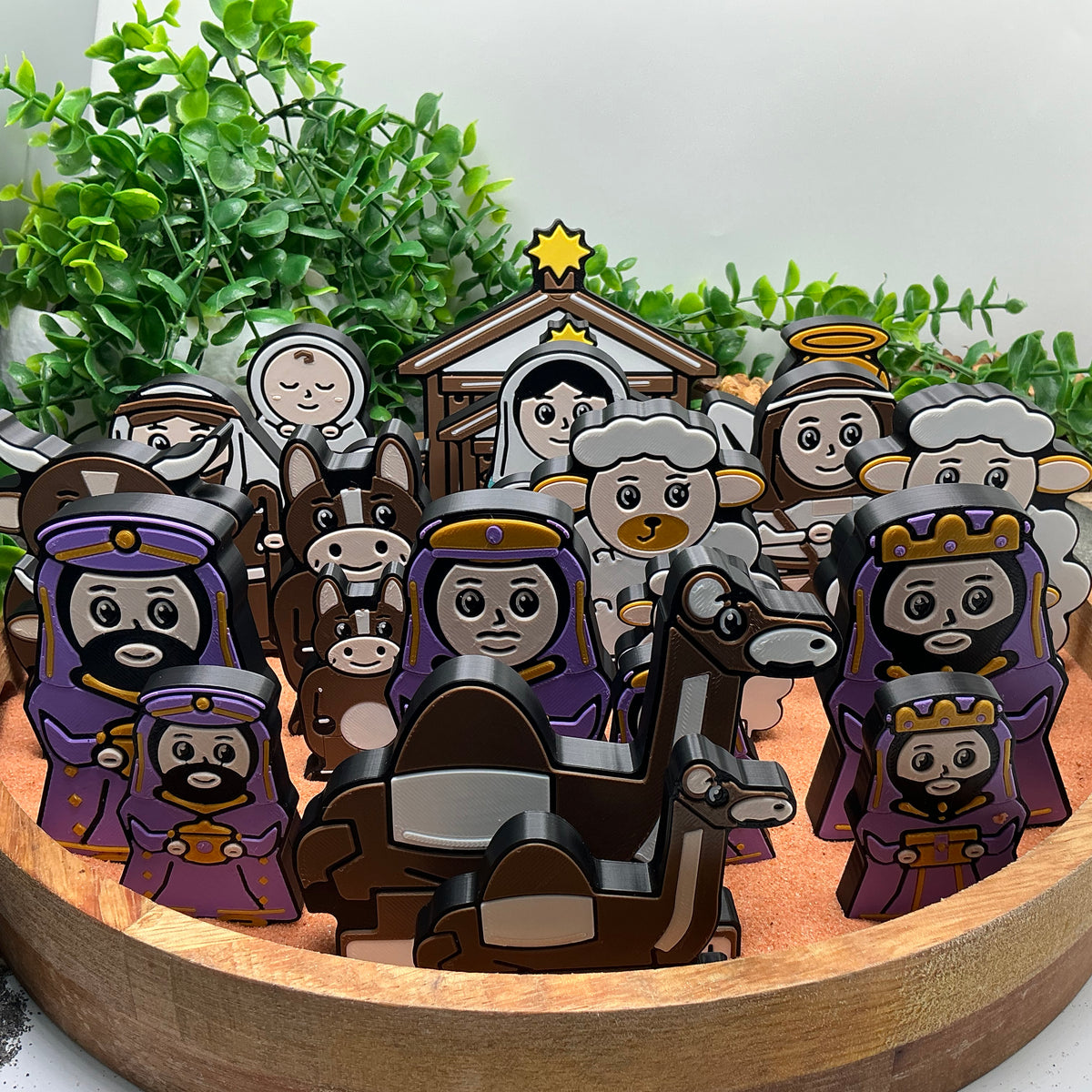 Both sizes of the Nativity collection arranged together; each purchase supplies one complete 14-piece set in the chosen size