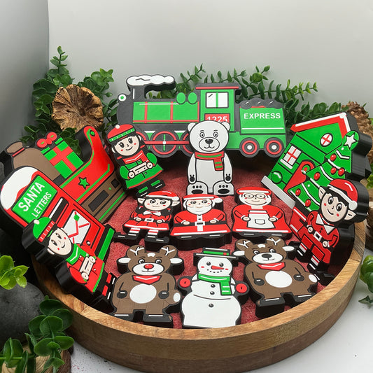 Complete Christmas story collection standing in a red sand tray, with characters, train, cottage, sleigh, tree and Santa letters post box