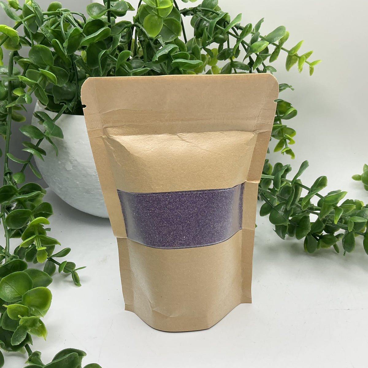 Purple coloured play sand pouch
