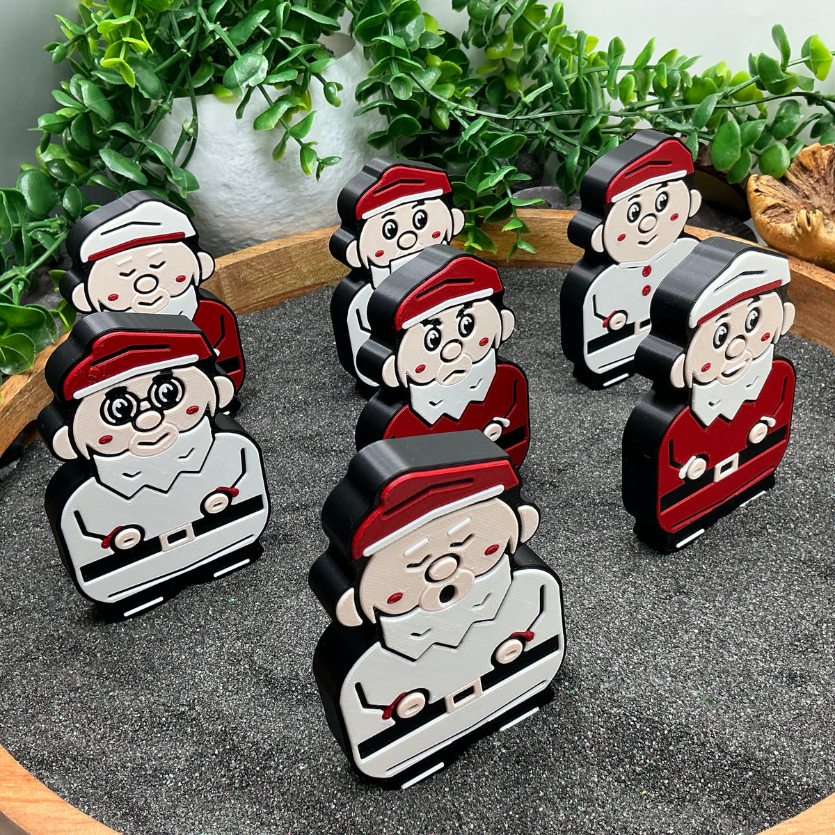 Seven dwarf figures standing together in the Snow White play scene