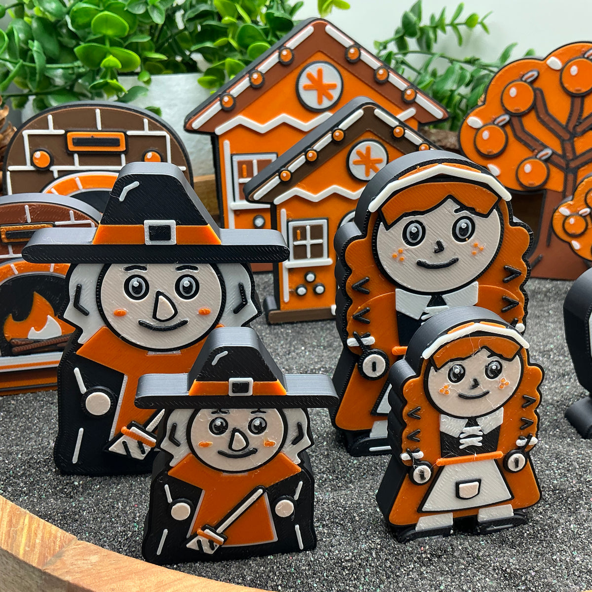 Close-up comparing Large and Small witch and Gretel figures