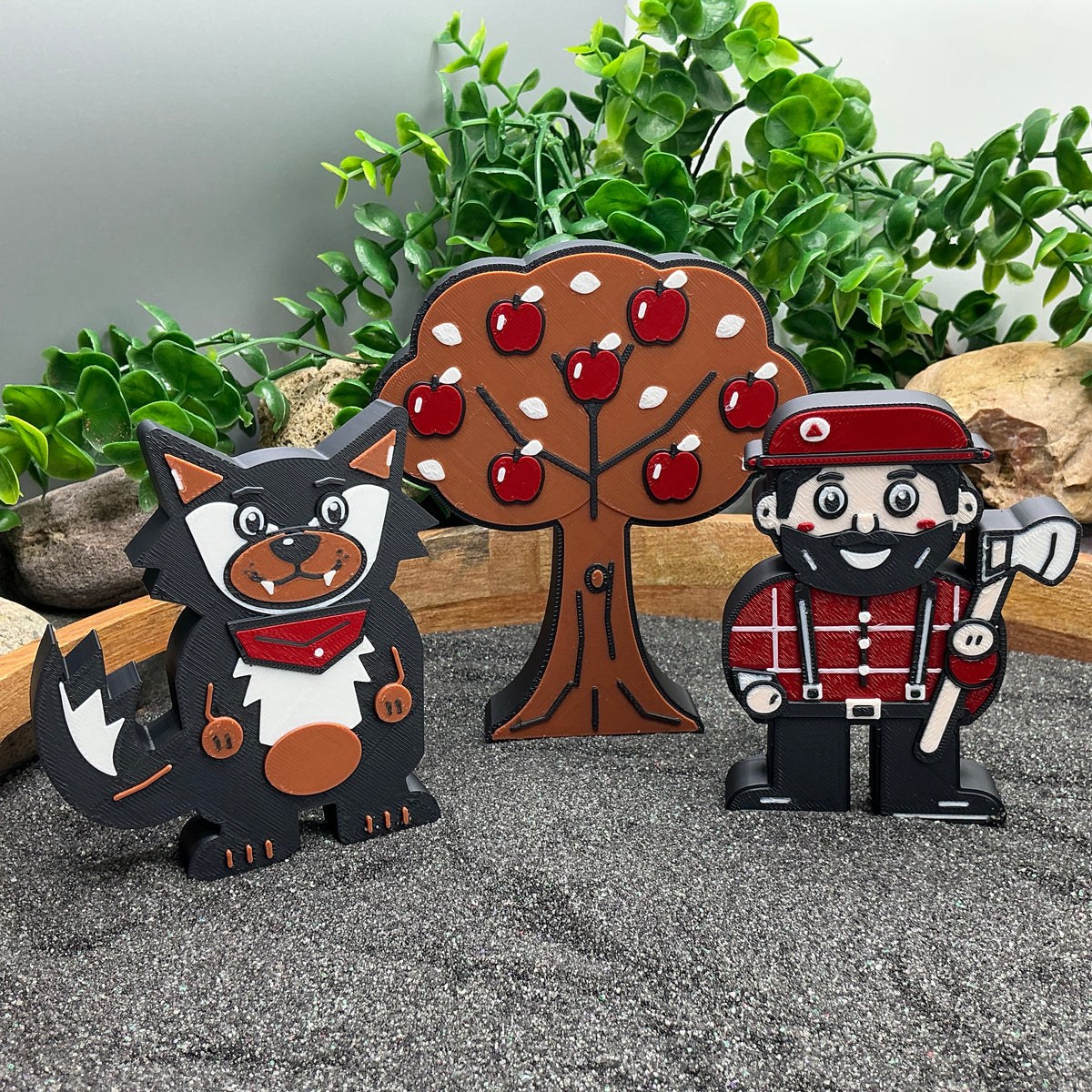 Wolf, apple tree and woodcutter standing in sand