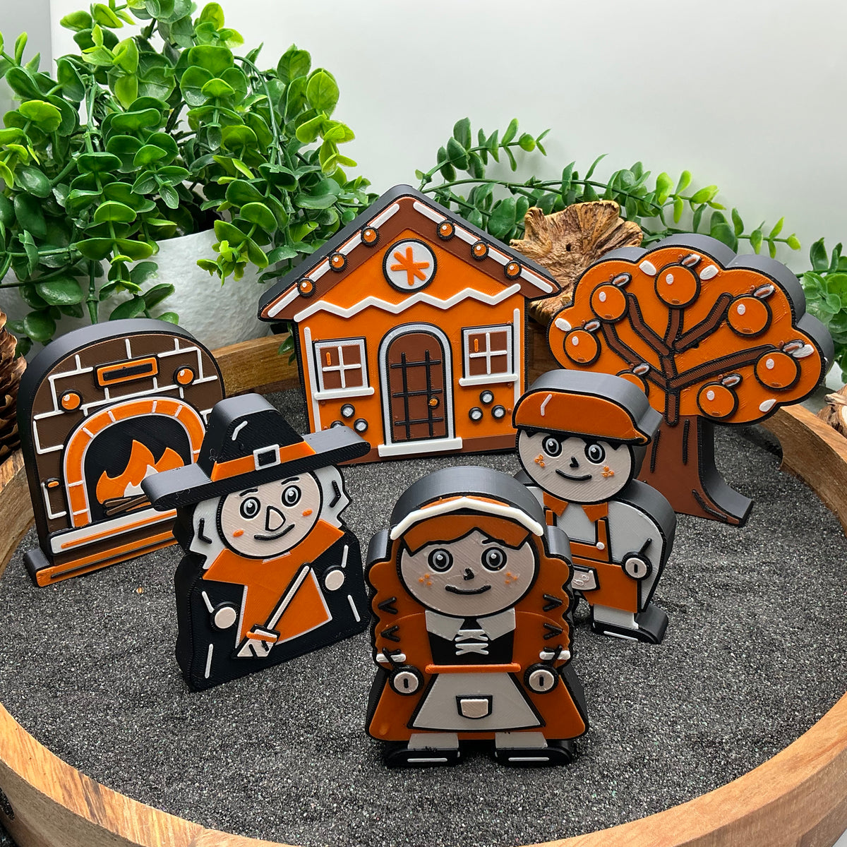 Large six-piece Hansel and Gretel story set standing in a wooden sand tray