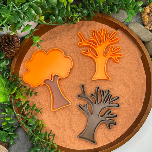 Autumn tree sensory filling tray set, orange leafy tree and two bare branch trees in a sand tuff tray