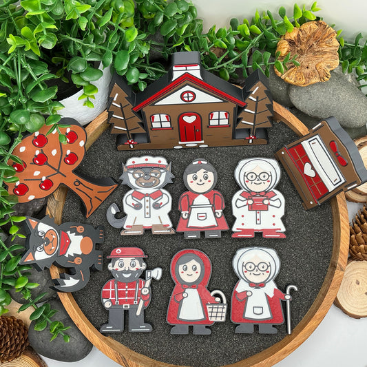 Large ten-piece Little Red Riding Hood story set laid in a wooden sand tray, with seven characters, cottage, apple tree and Grandma's bed