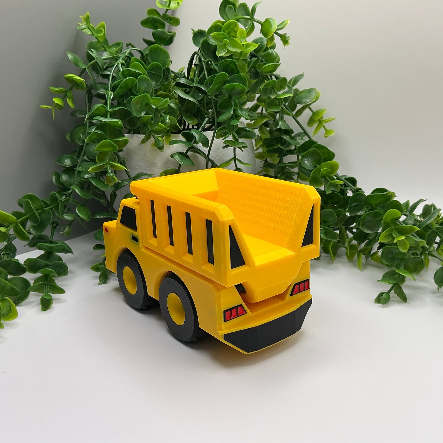 Large 3D-printed multi-coloured dump truck construction vehicle with tipper bed - view 2 of 5