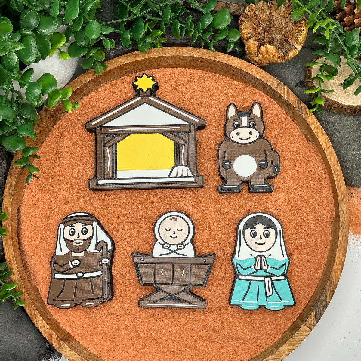 Nativity stable, donkey, Joseph, baby Jesus in the manger and Mary laid flat in a wooden tray