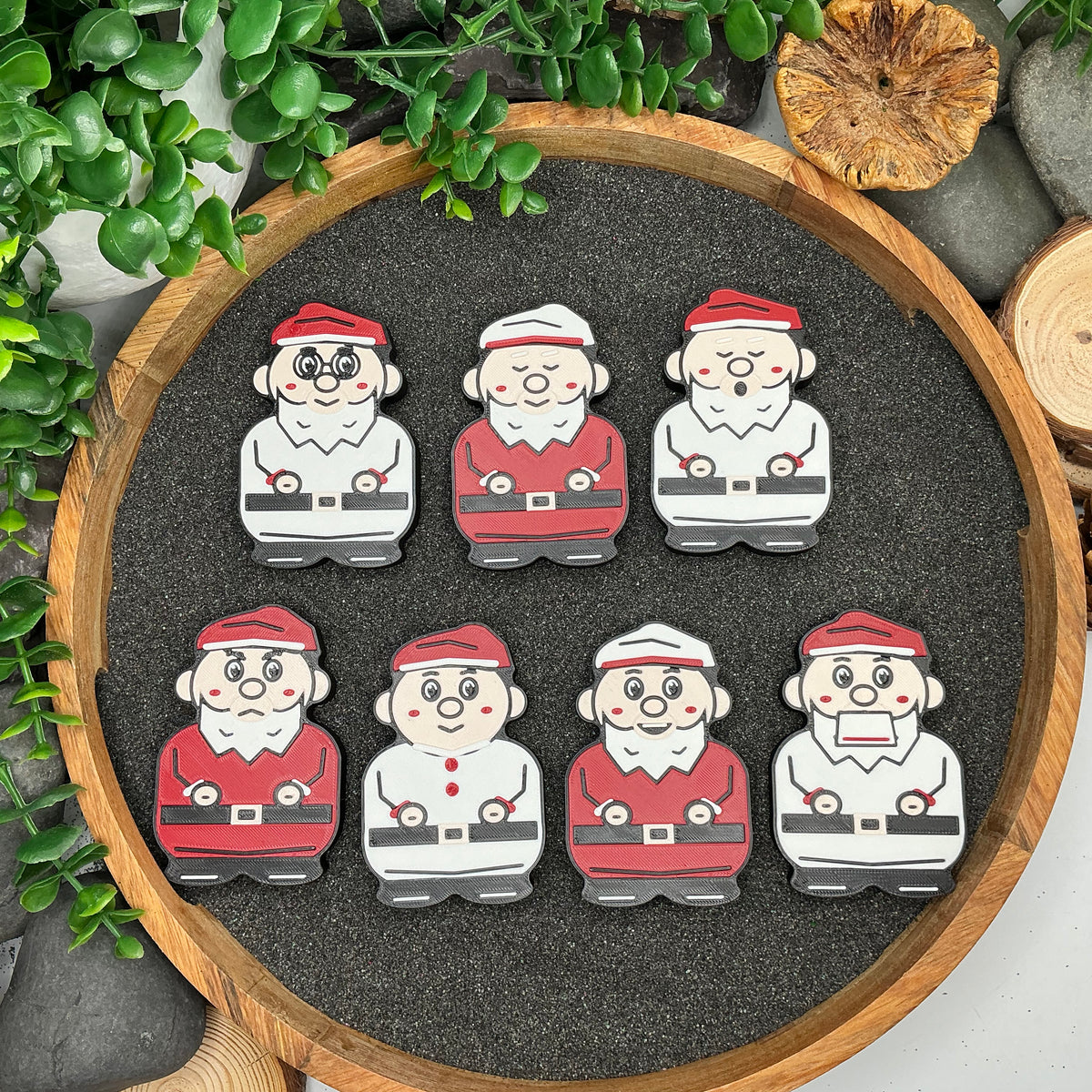 All seven dwarf character figures laid flat, showing their different expressions and red, white, beige and black details