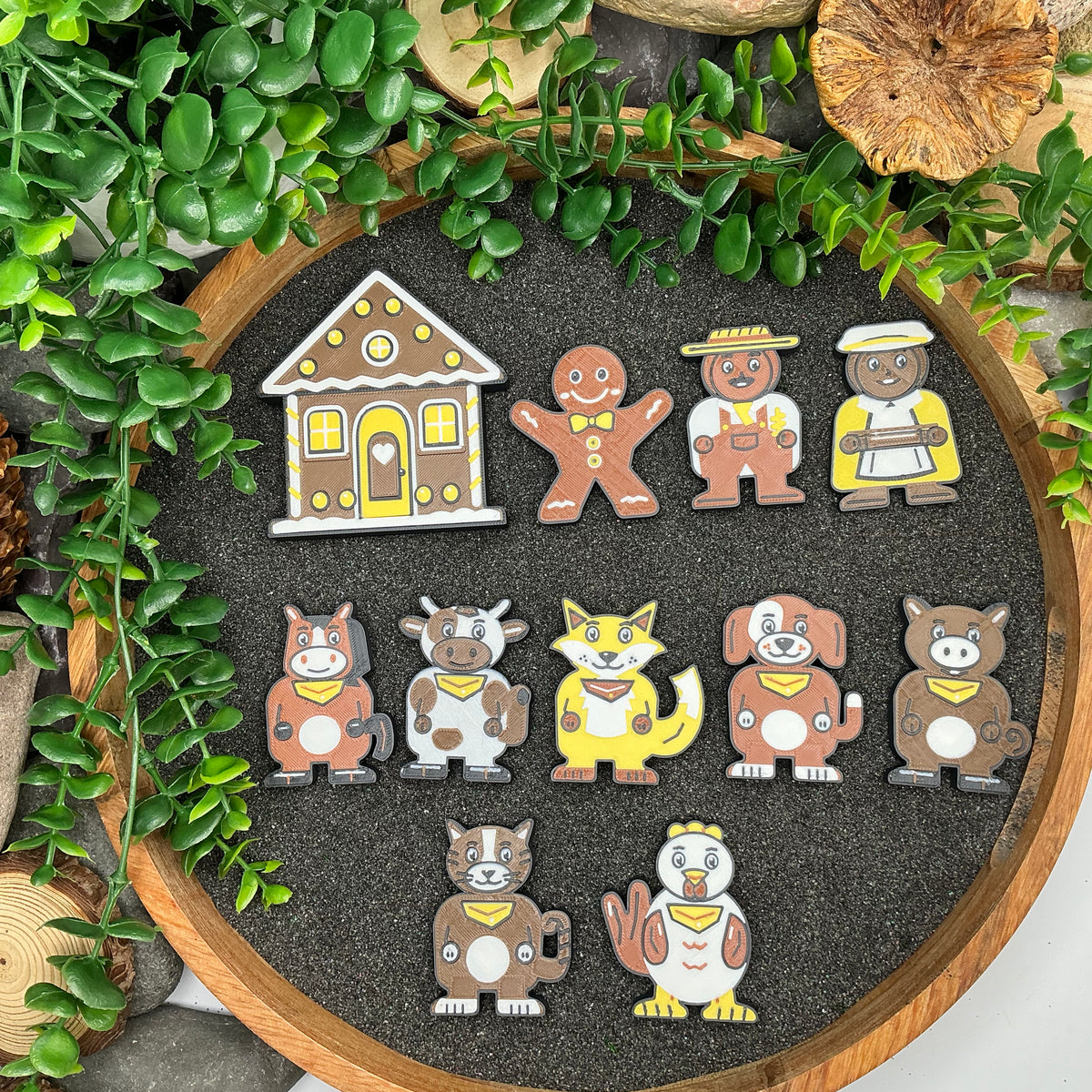 Small Gingerbread Man 11 piece story set laid flat in a wooden sand tray