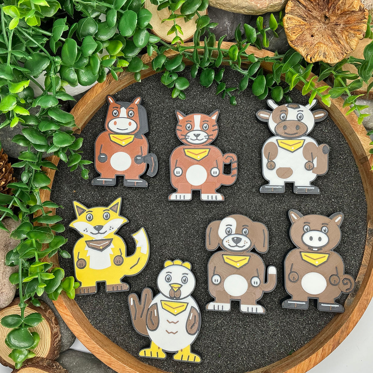 Seven animal figures from the Gingerbread Man story set laid out in a sand tray