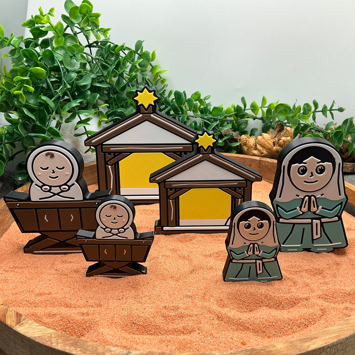 Large and Small Nativity stable, Mary and baby Jesus standing together to compare the two sizes