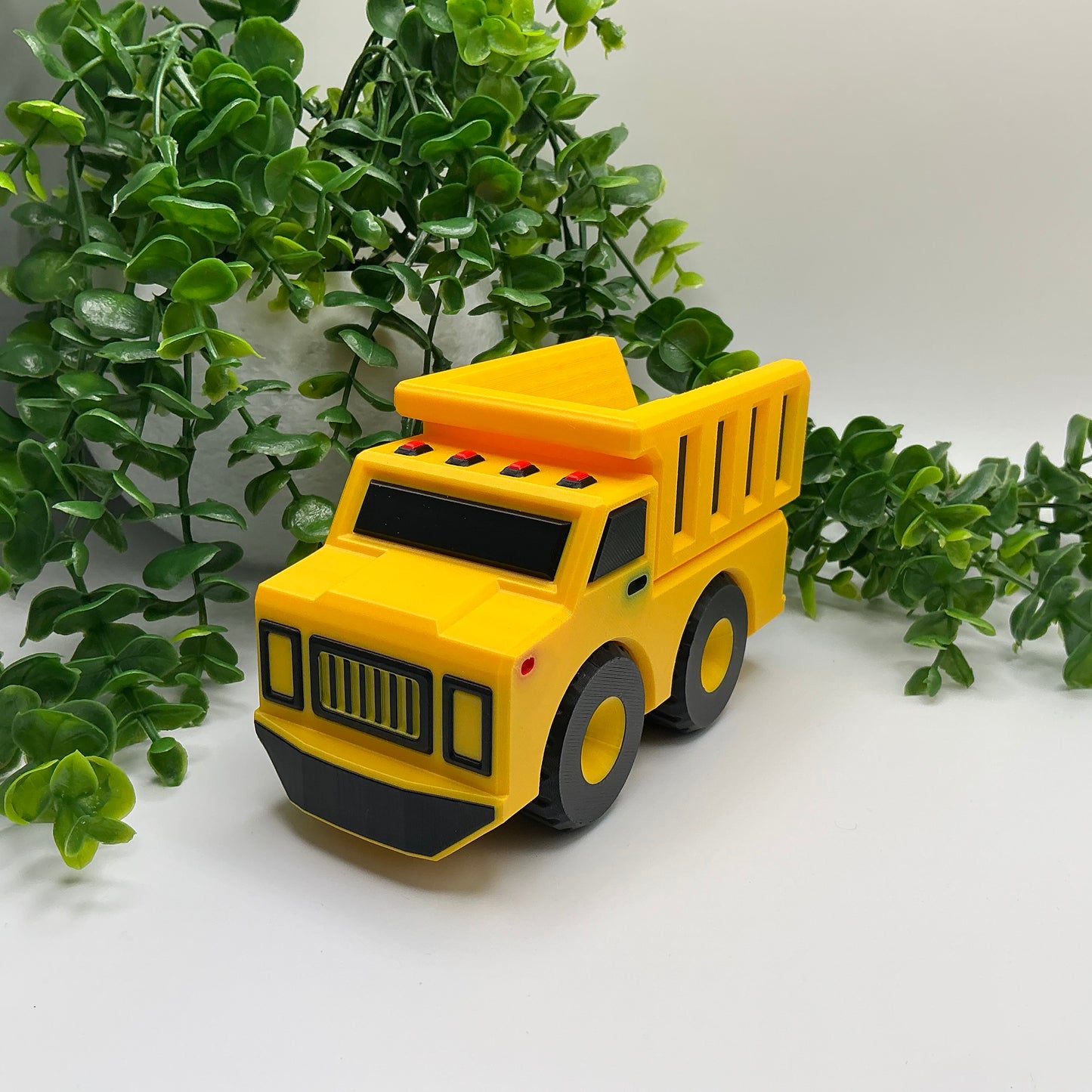 Large 3D-printed multi-coloured dump truck construction vehicle with tipper bed - view 1 of 5