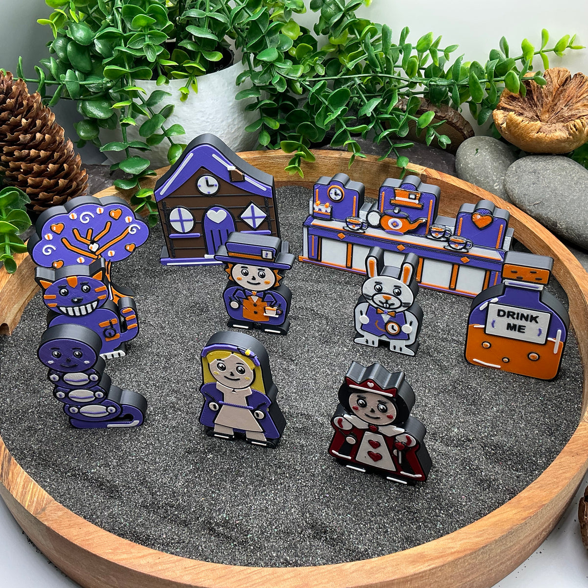 Angled view of the Small Alice in Wonderland set with blonde-haired Alice and matching scenery