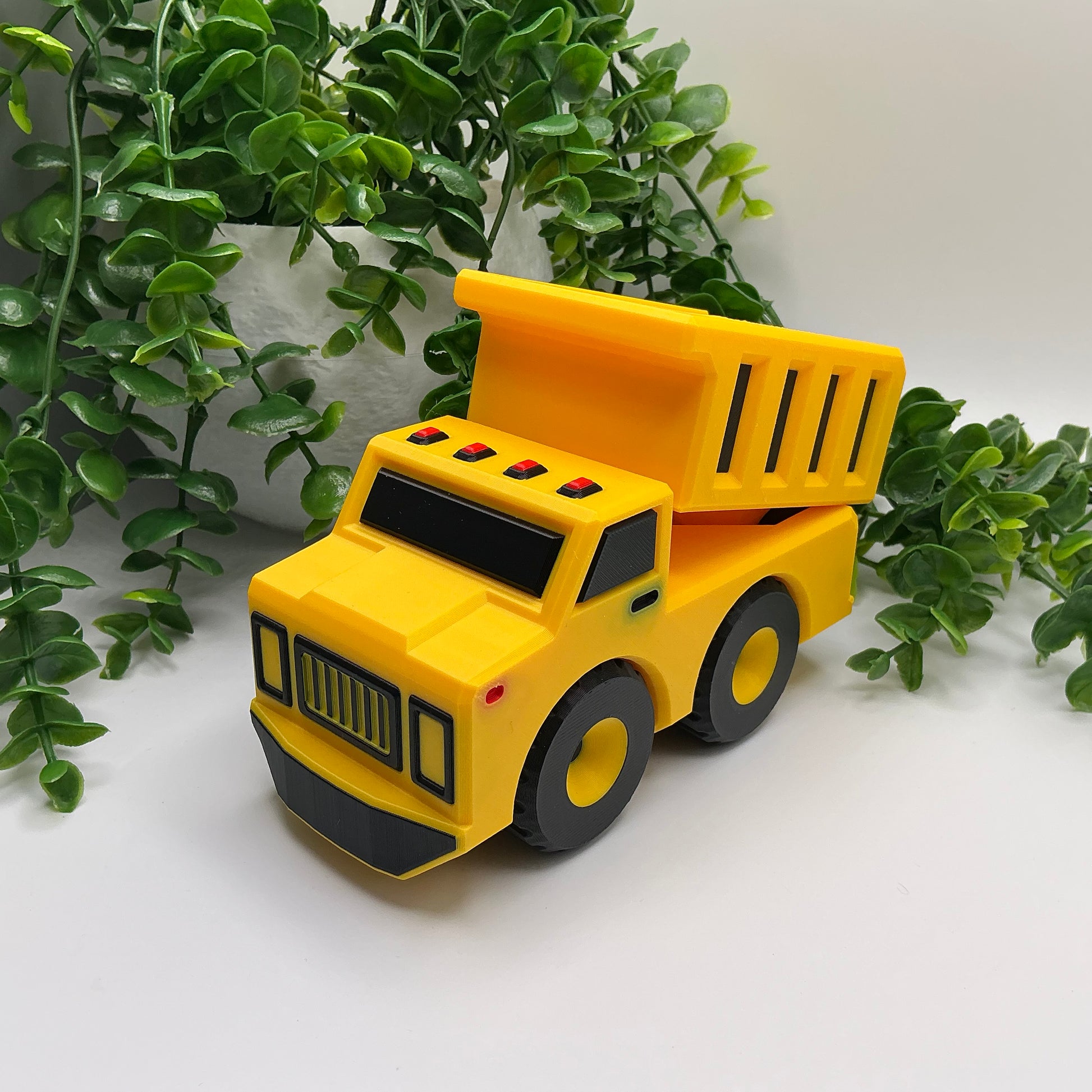 Large 3D-printed multi-coloured dump truck construction vehicle with tipper bed - view 4 of 5