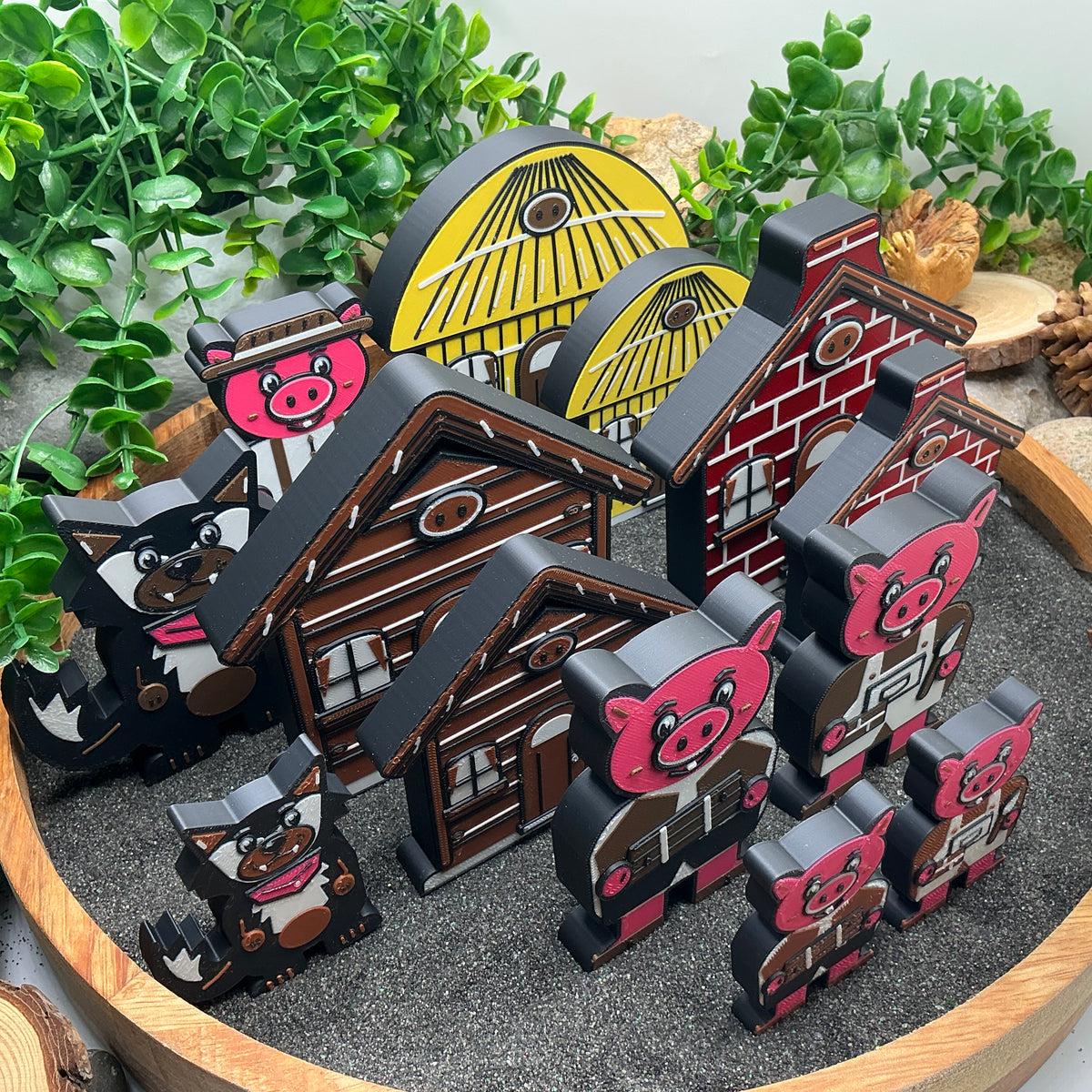 Side view comparing Large and Small Three Little Pigs story pieces