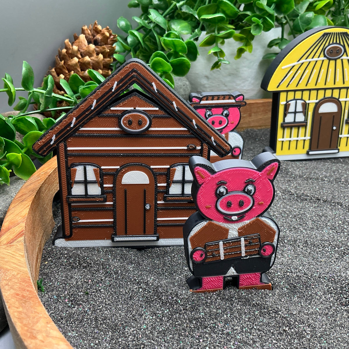 Small pig figure standing beside the brown stick house