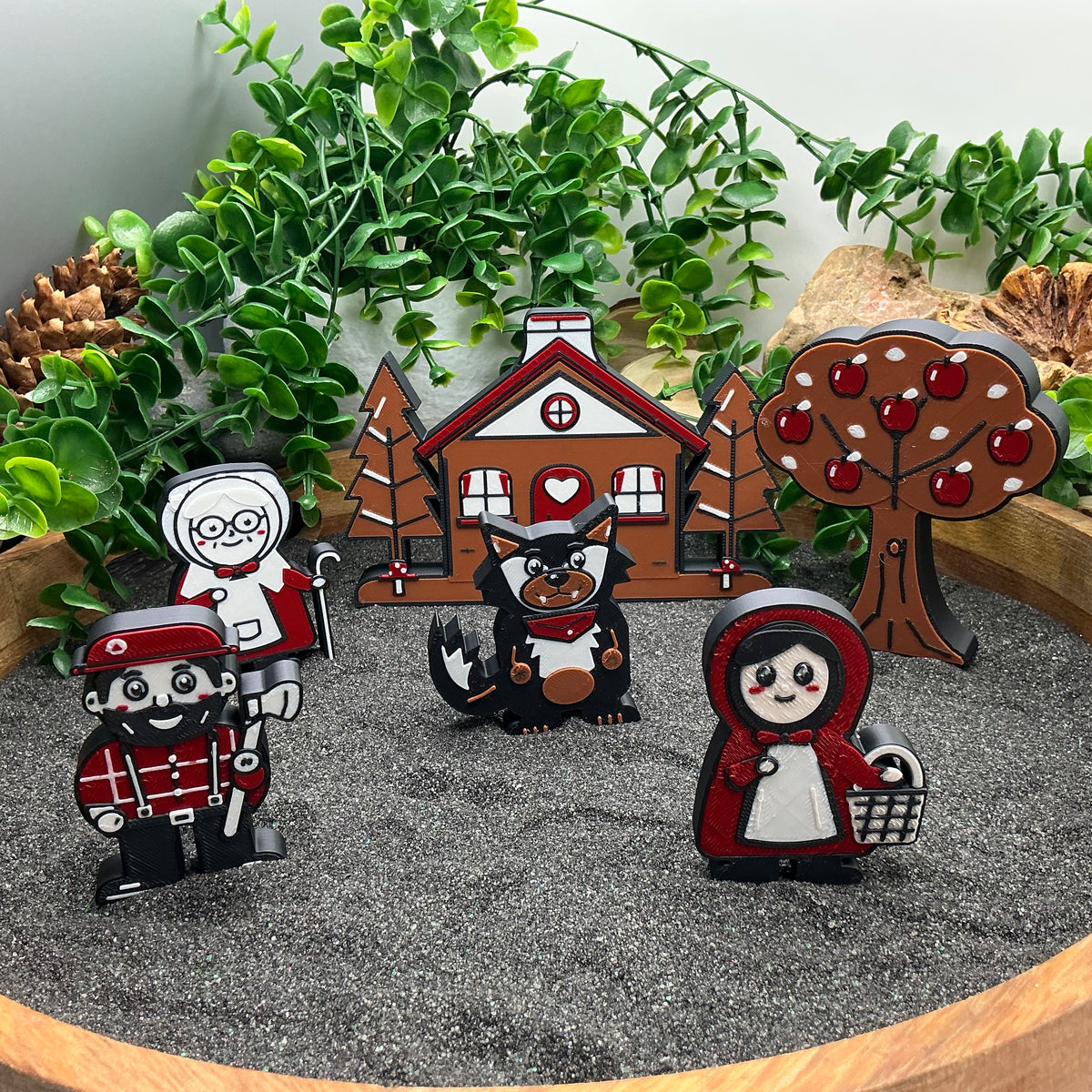 Little Red Riding Hood story scene with cottage and apple tree