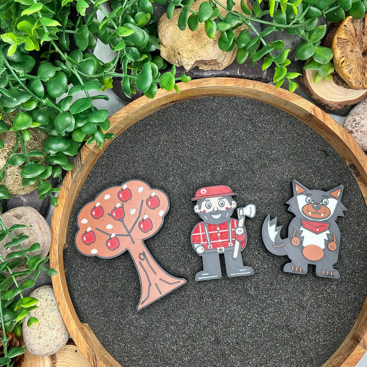 Apple tree, woodcutter and wolf figures