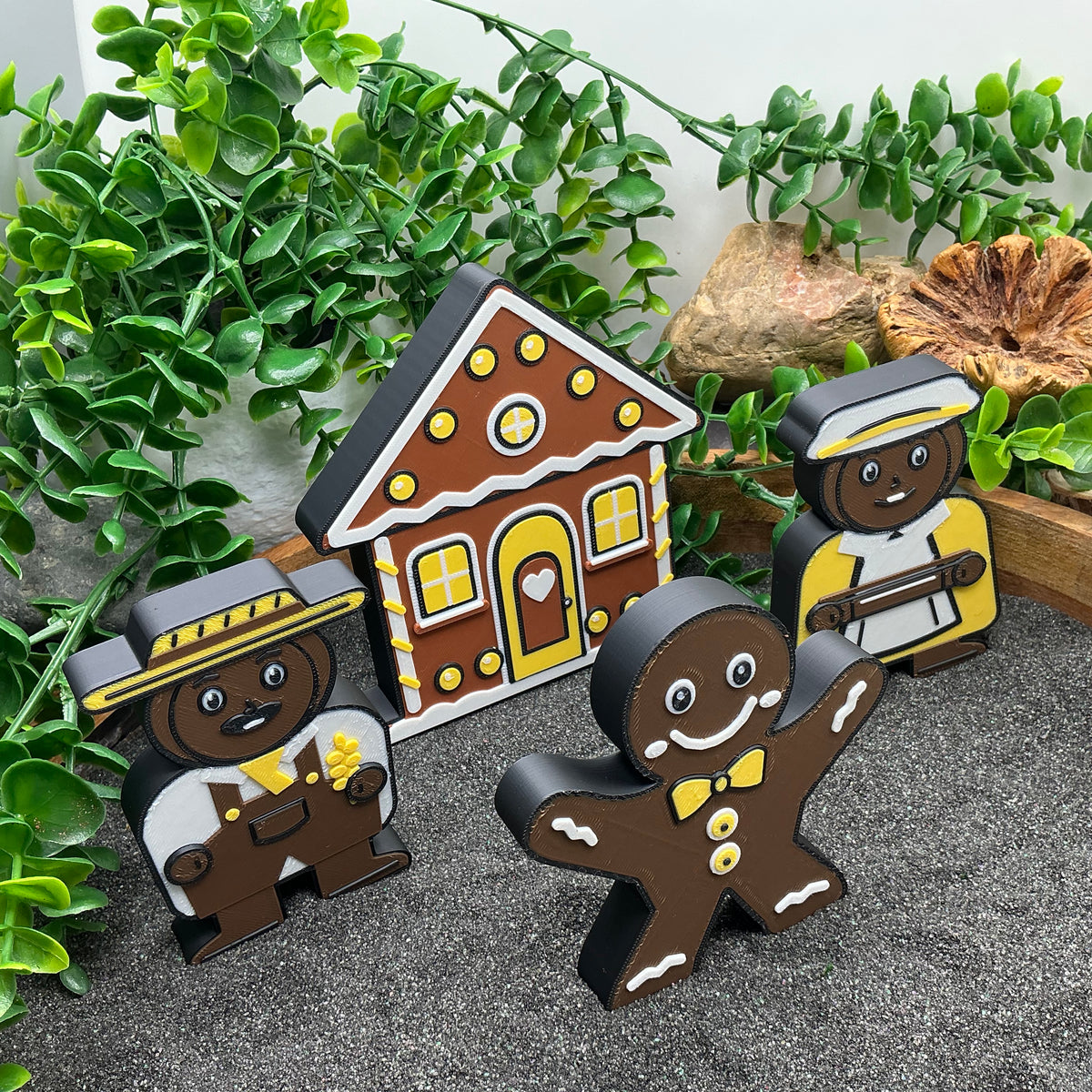 Gingerbread Man, farmer and farmer's wife standing beside the gingerbread house