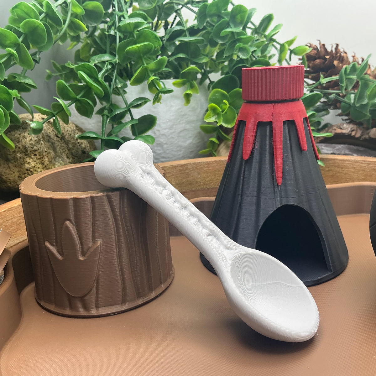Tree-stump pot, bone scoop and volcano with red cap