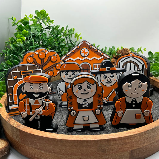Large Hansel and Gretel story set standing in a tray, with Woodcutter Father and Stepmother in front