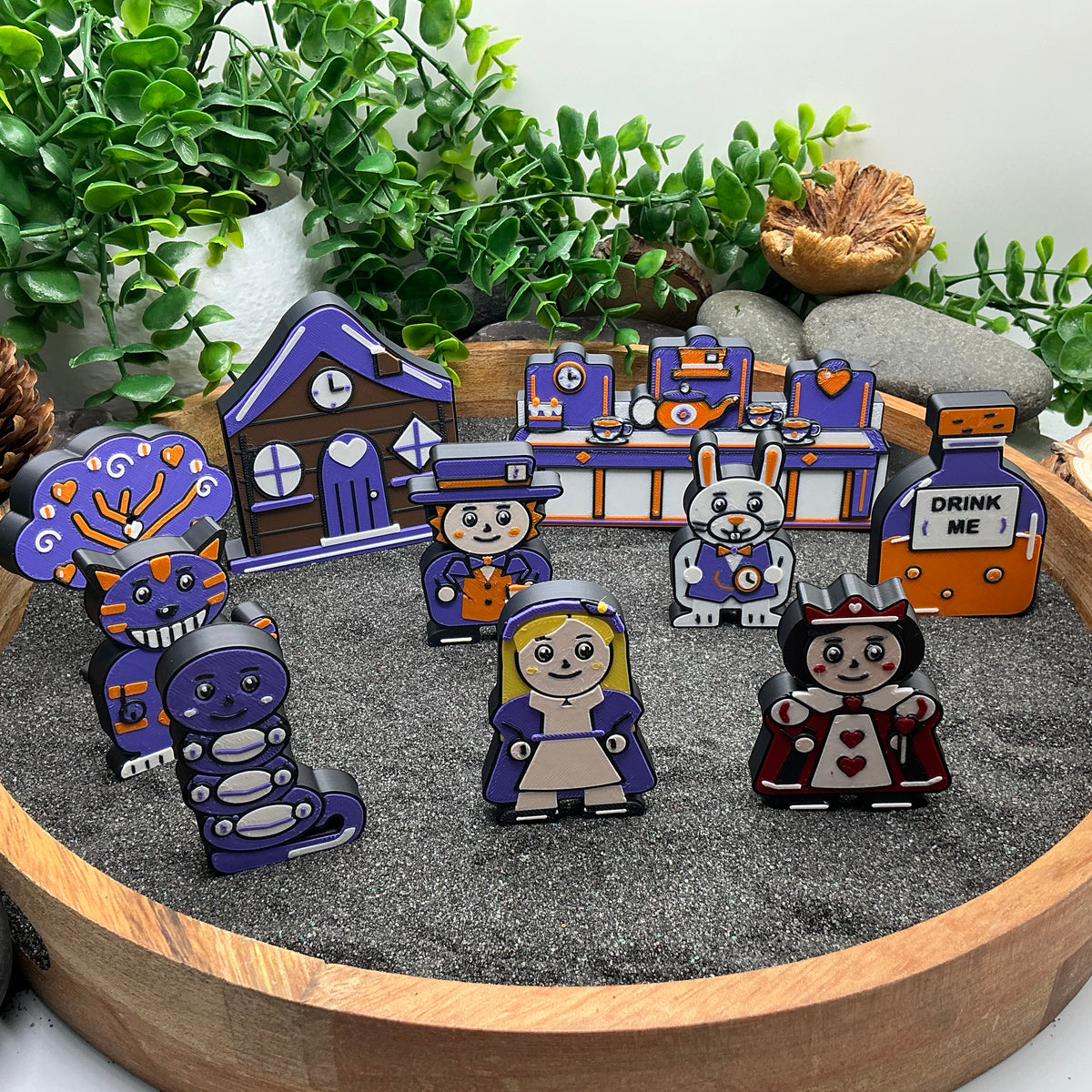Small Alice in Wonderland ten-piece story set standing in a wooden sand tray