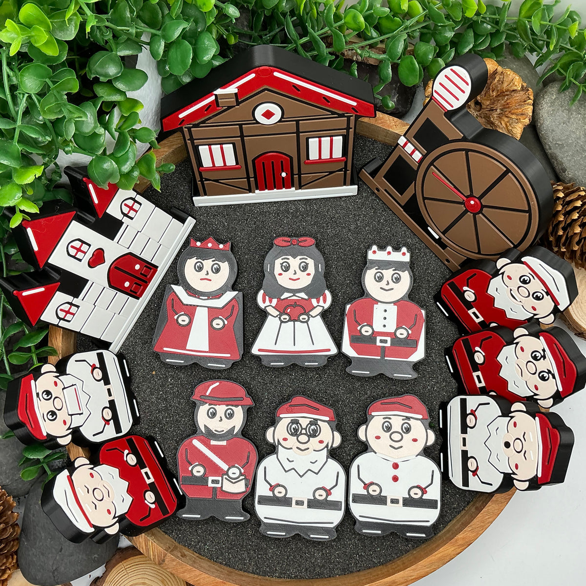 Complete 14-piece Snow White story set laid flat in a wooden tray, with eleven characters, castle, cottage and spinning wheel