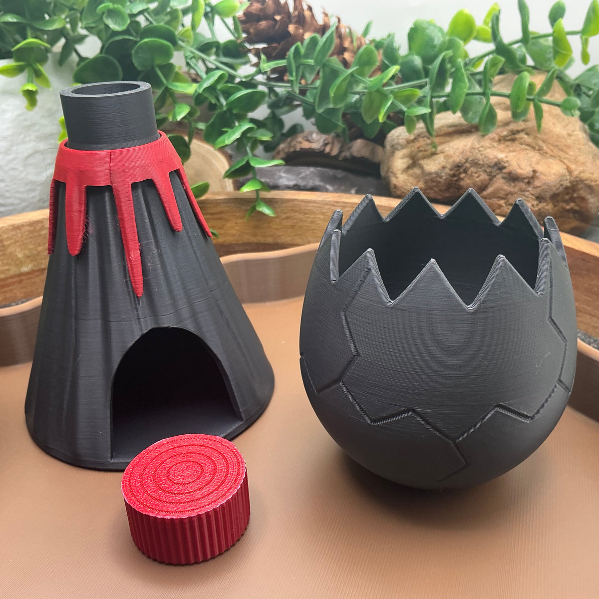 Black volcano with red lava, red lava cap and cracked dinosaur egg