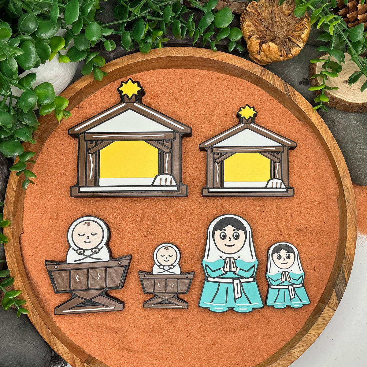Large and Small Nativity stables, baby Jesus in manger and Mary figures shown together for size comparison