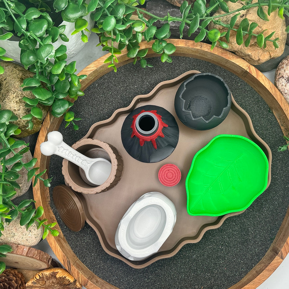 Dinosaur sensory kit from above with the tree-stump pot lid off