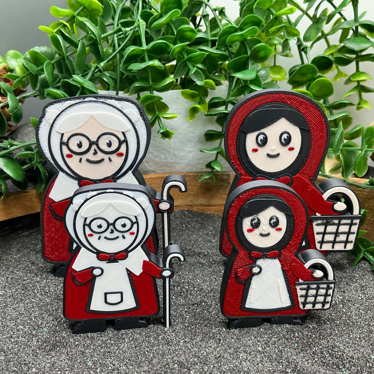 Large and small Grandma and Little Red Riding Hood figures compared