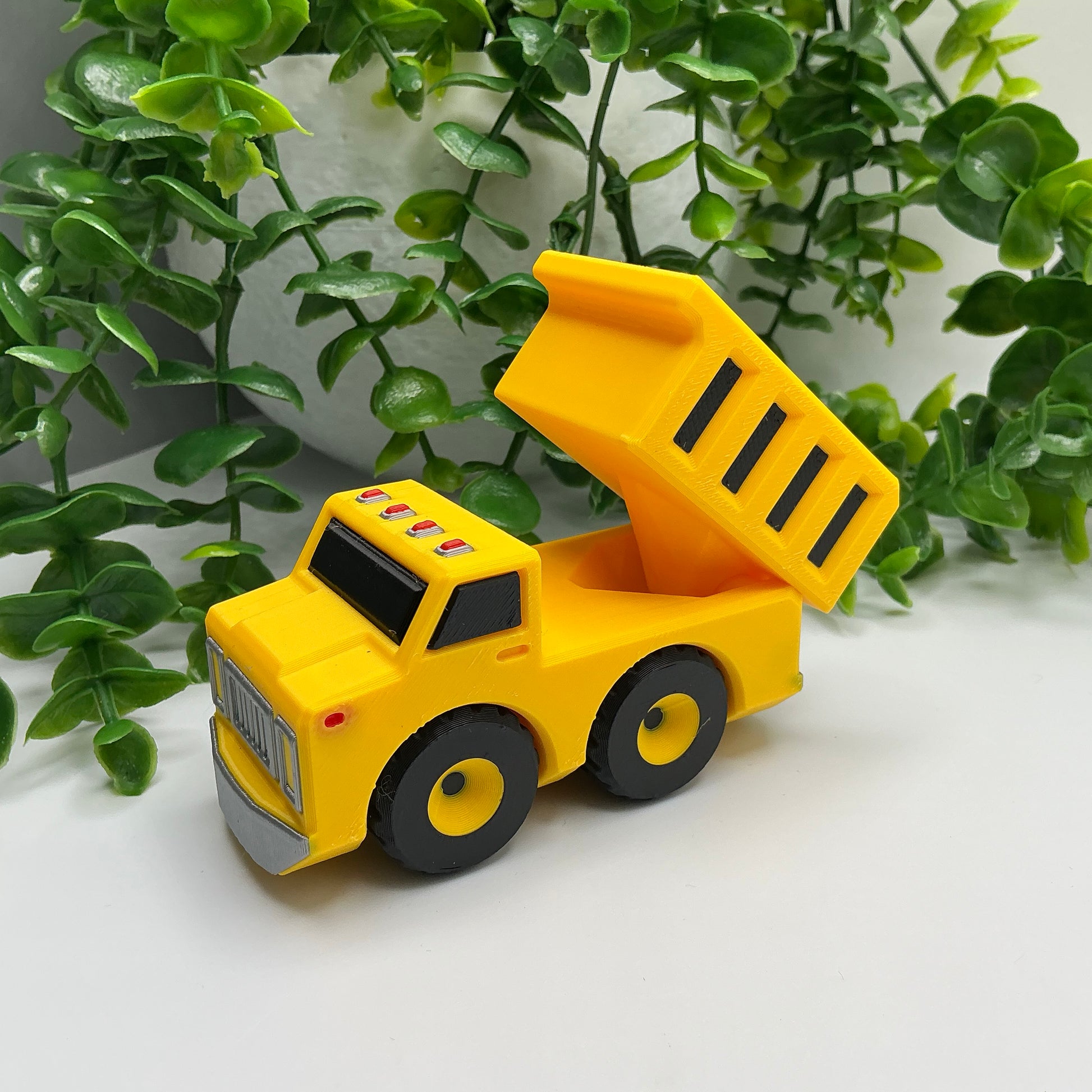 3D-printed multi-coloured dump truck construction vehicle with tipper bed - view 3 of 4