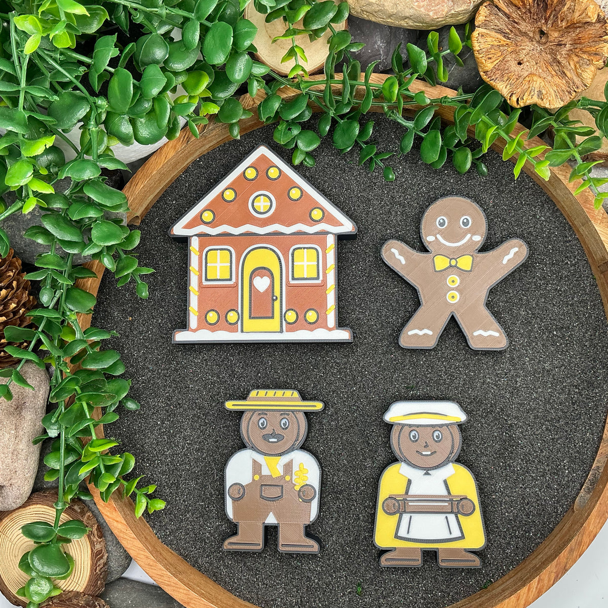 Gingerbread house, Gingerbread Man, farmer and farmer's wife laid flat in sand