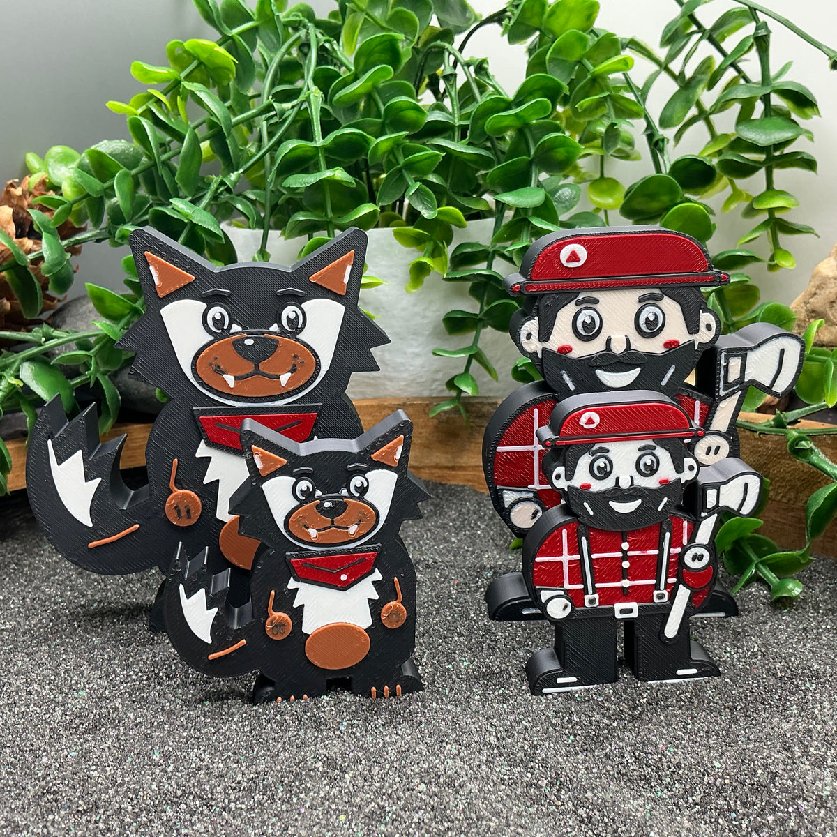 Large and small wolf and woodcutter figures compared