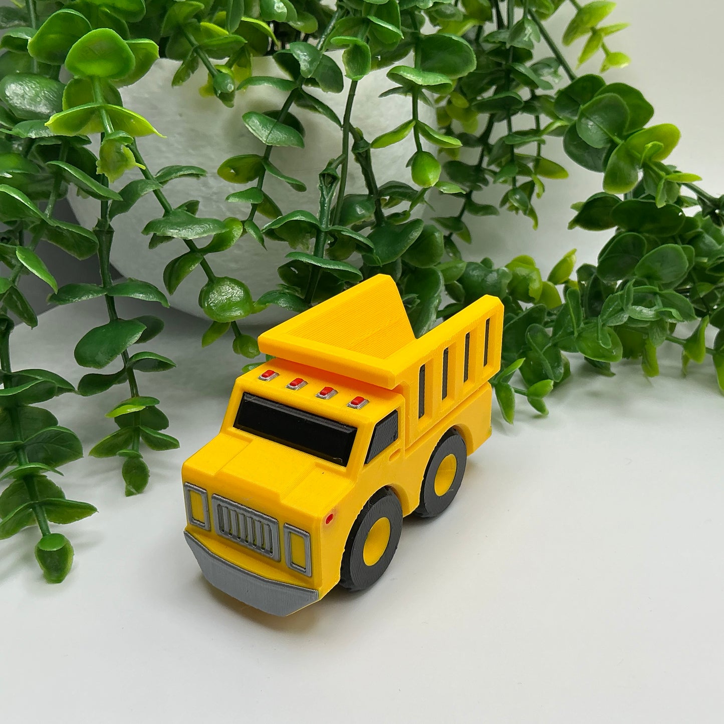 3D-printed multi-coloured dump truck construction vehicle with tipper bed - view 2 of 4