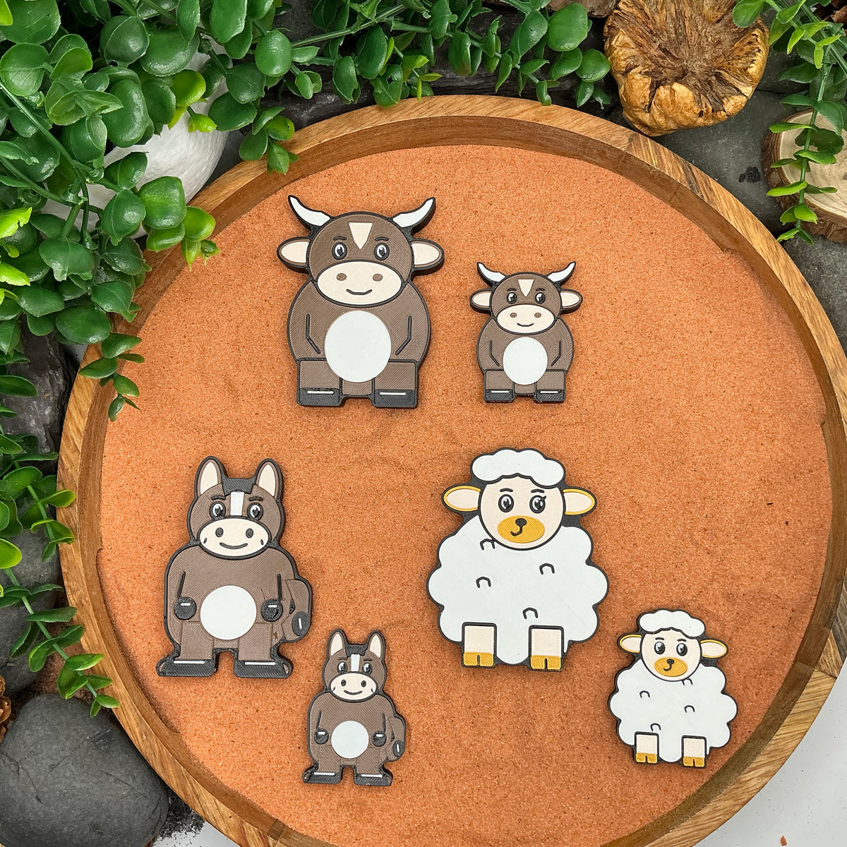 Large and Small Nativity ox, donkey and sheep figures laid flat for size comparison