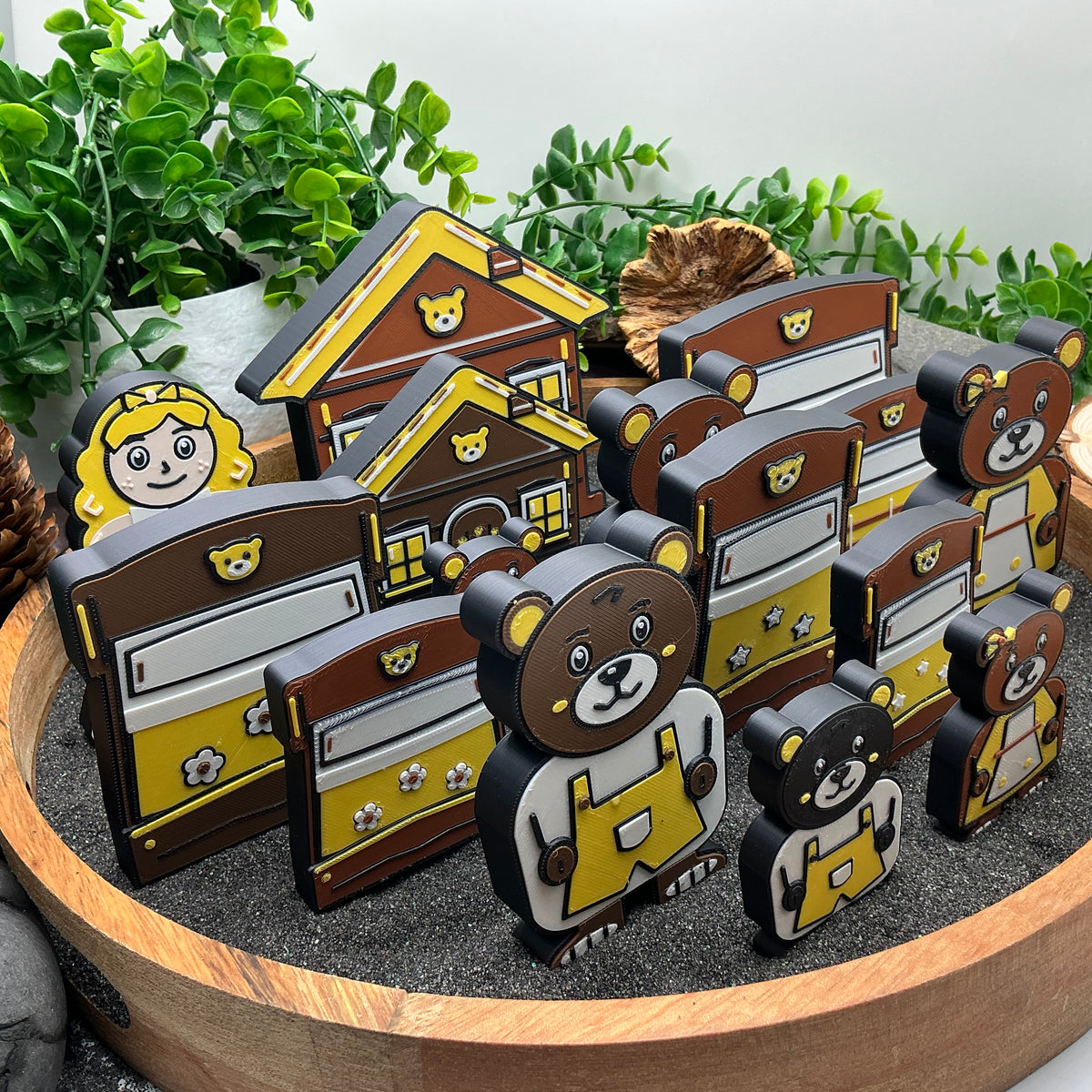 Side view comparing Large and Small Goldilocks characters, beds and cottages
