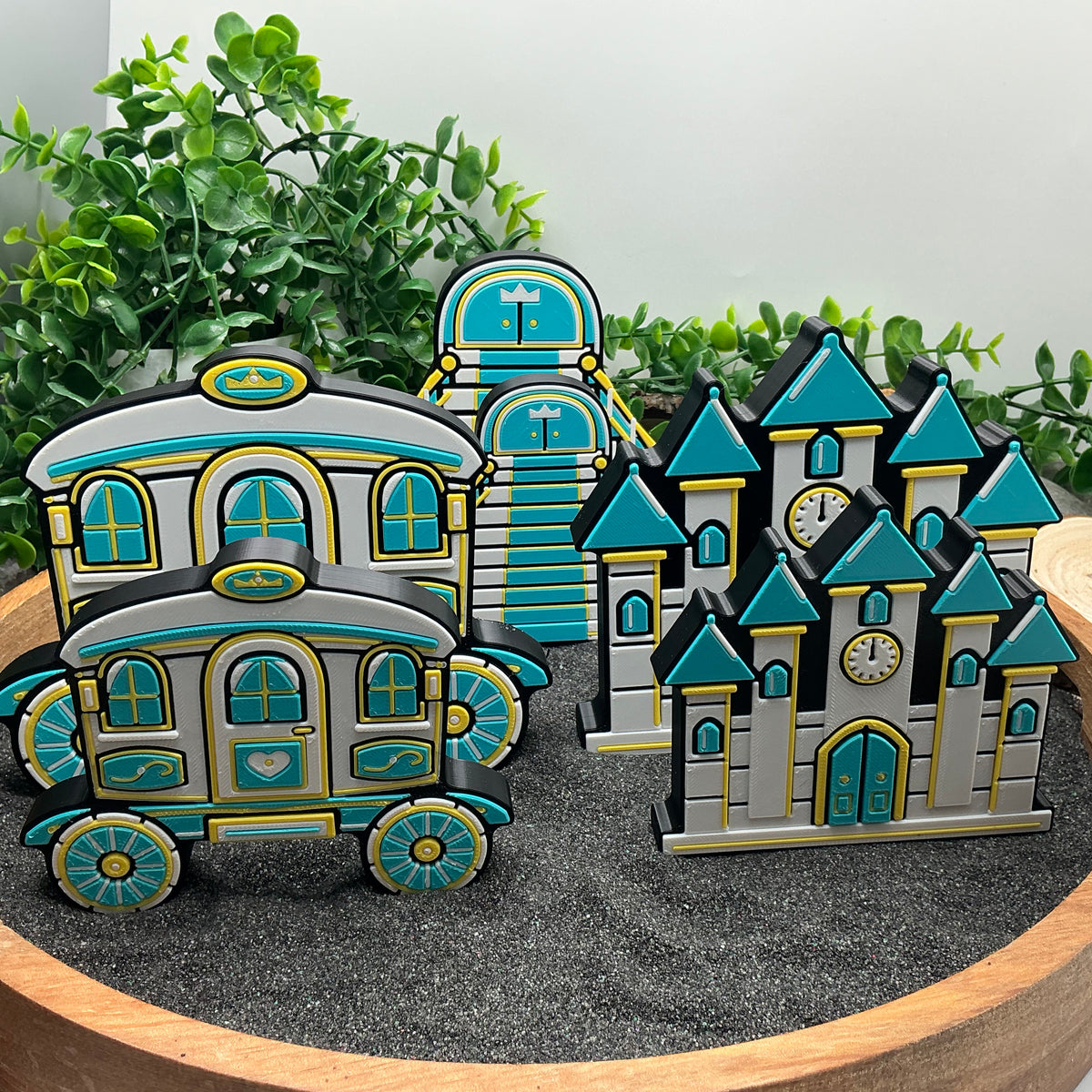 Large and Small Cinderella carriages, staircases and castles standing together for a size comparison