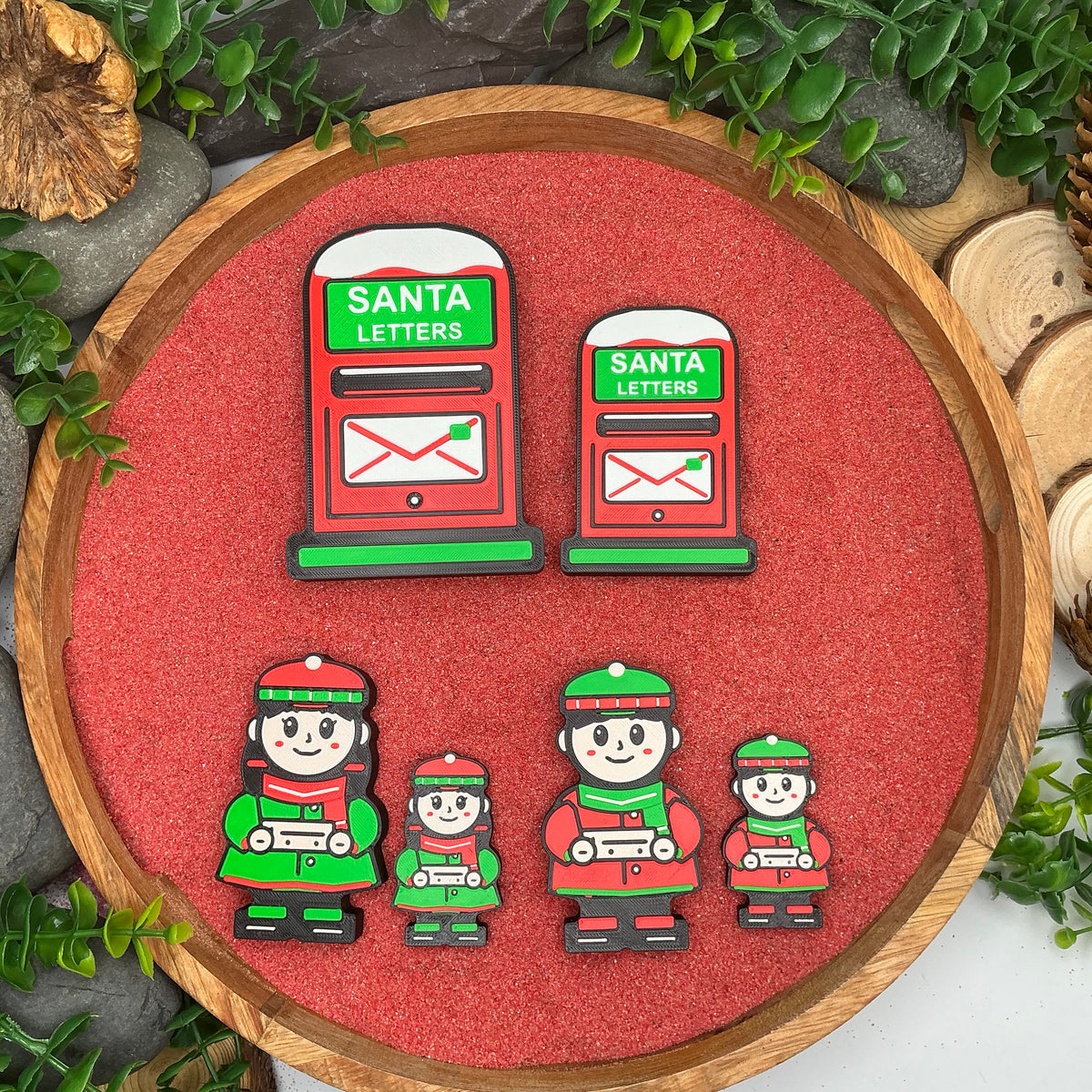 Large and Small Santa letters post boxes, winter boys and winter girls holding tickets compared side by side