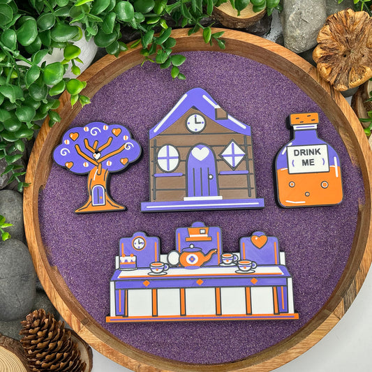 Wonderland cottage, tree, Drink Me bottle and tea-party scene laid flat in a wooden tray with purple sand