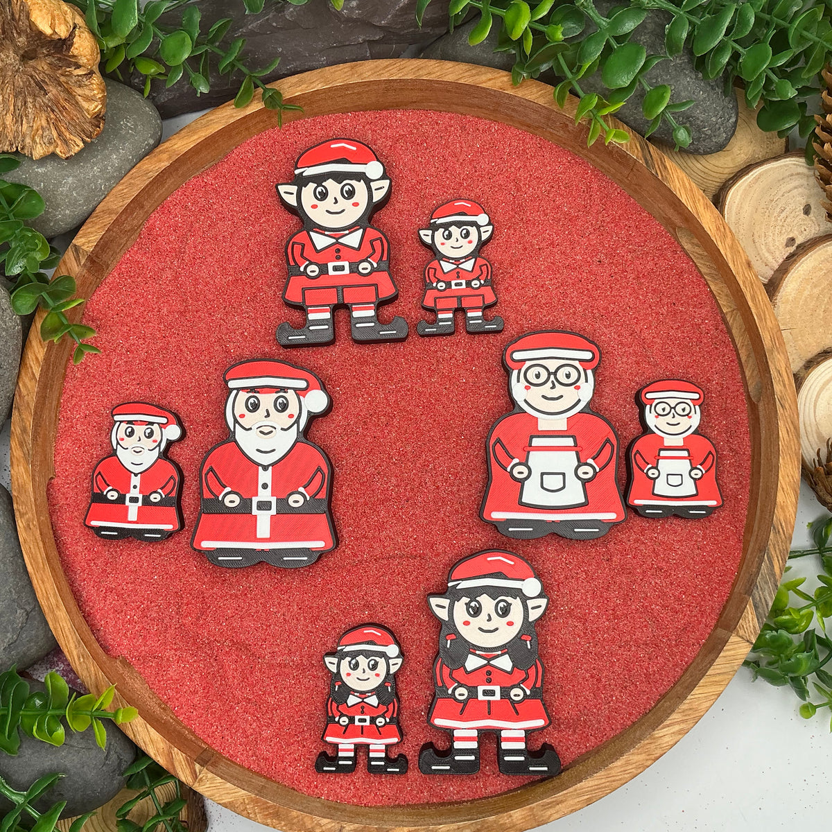 Large and Small Mr Claus, Mrs Claus, boy elf and girl elf figures compared in pairs