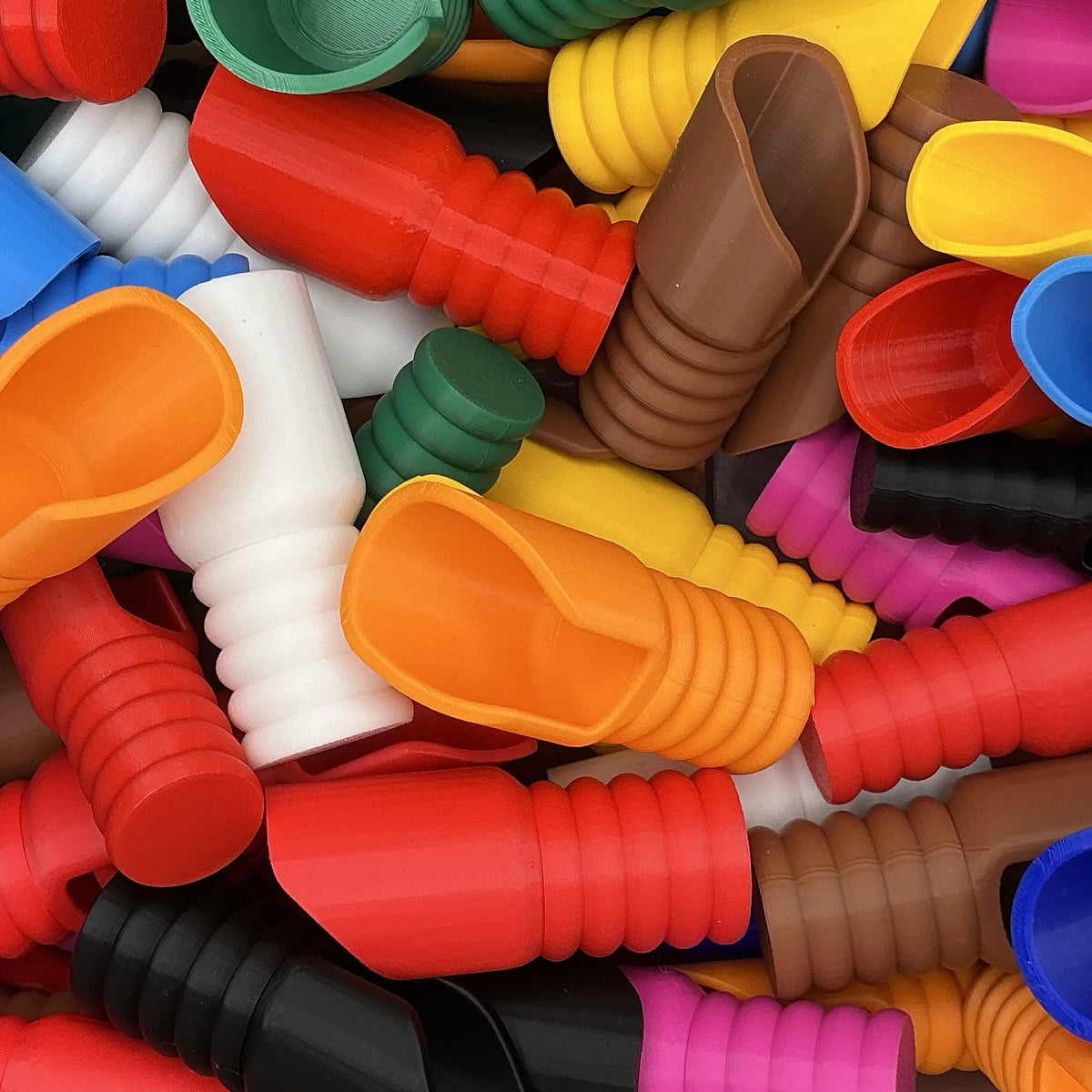 Close-up of colourful 3D printed pouring scoops