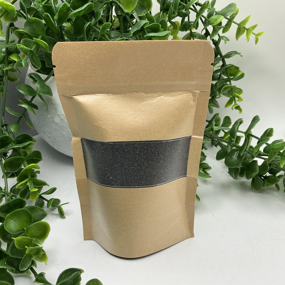 Black coloured play sand pouch