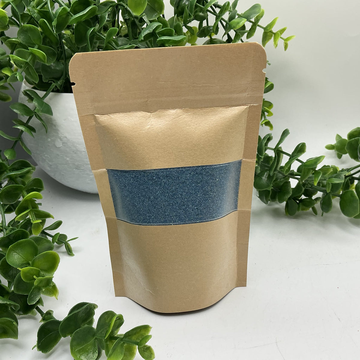 Blue coloured play sand pouch